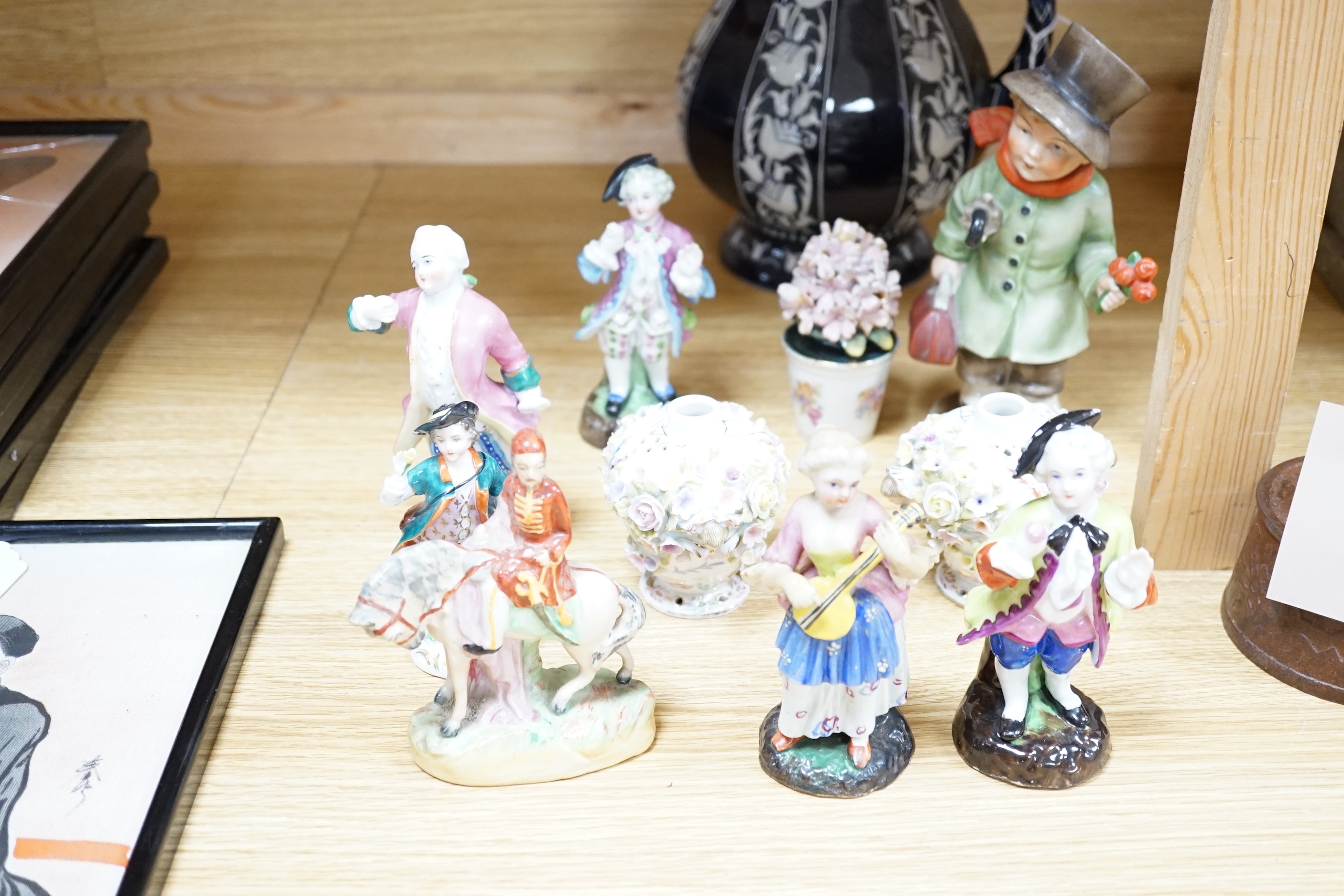Mixed ceramics; a Madonna and child group, a jug, a pair of Sitzendorf miniature flower encrusted vases, nine small German style figures, etc. (18)